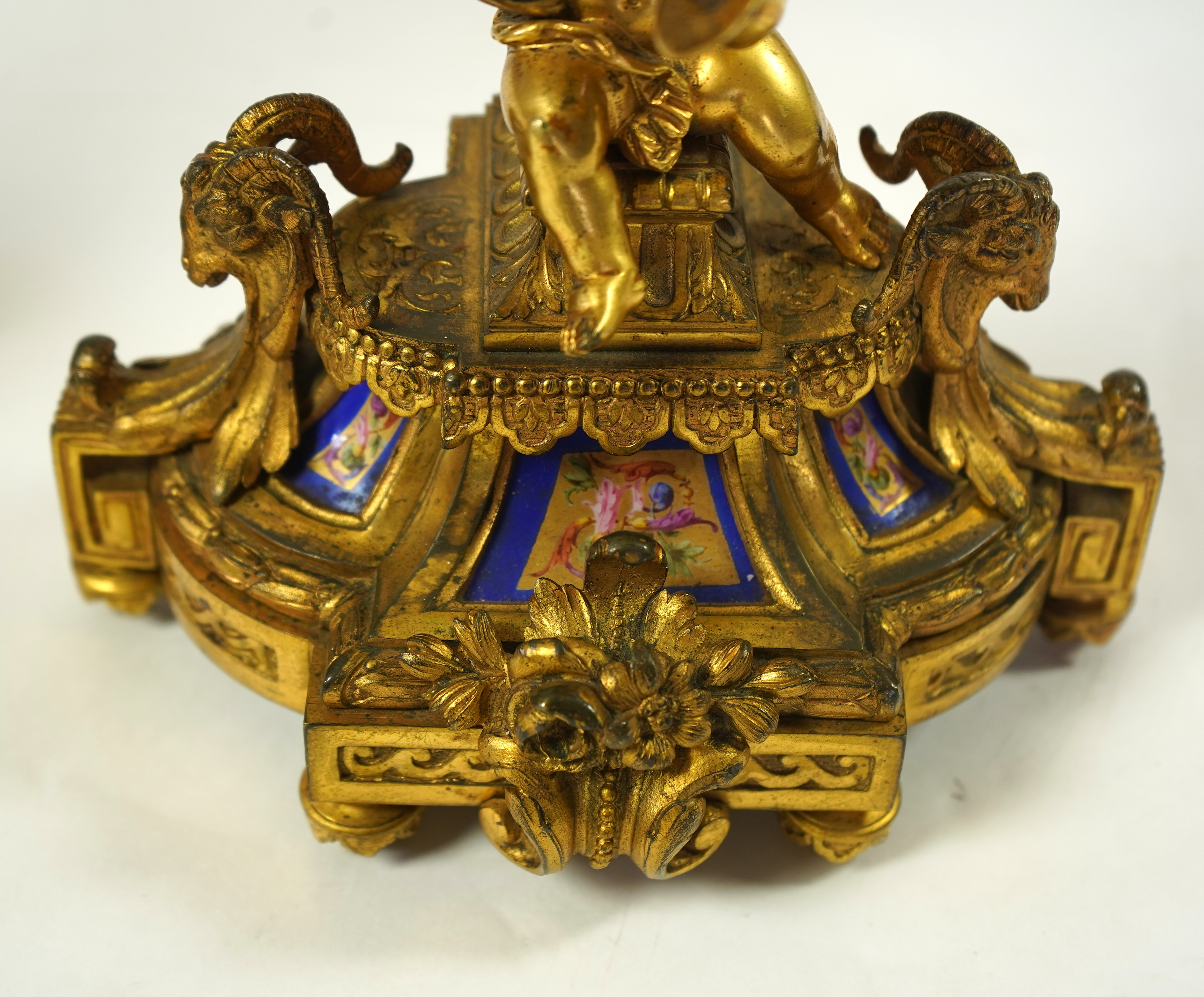 A pair of 19th century French Louis XVI style ormolu three light candelabra